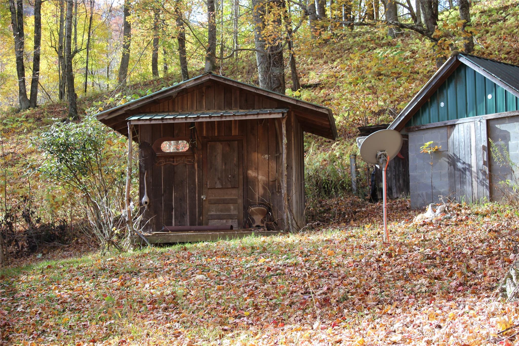 1571 Roaring Fork Road Burnsville, NC 28714 - Photo 34 of 37 a front view of a house with a yard