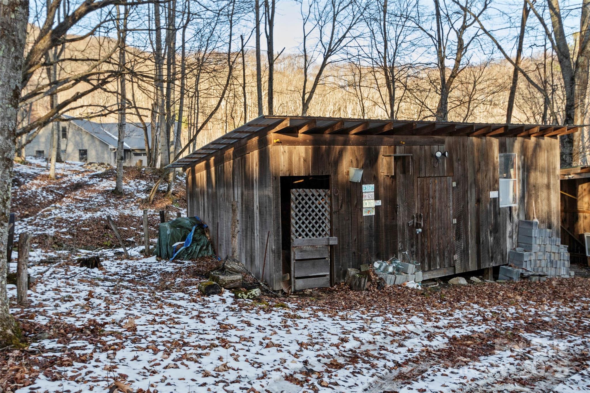 1571 Roaring Fork Road Burnsville, NC 28714 - Photo 7 of 37 a view of a house with a yard