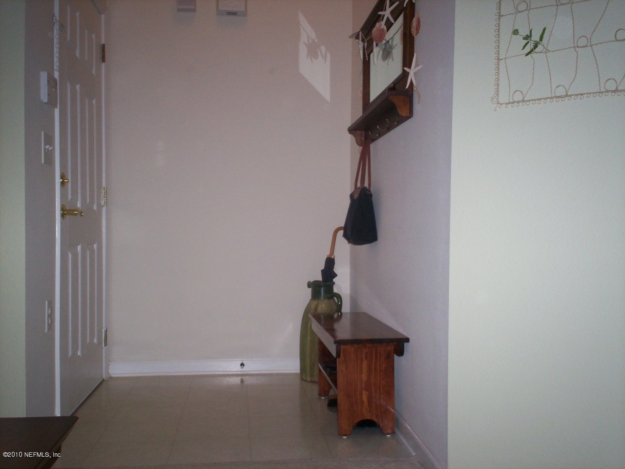 7920 Merrill Road, Unit 2104 Jacksonville, FL 32277 - Photo 4 of 9 a view of hallway with stairs