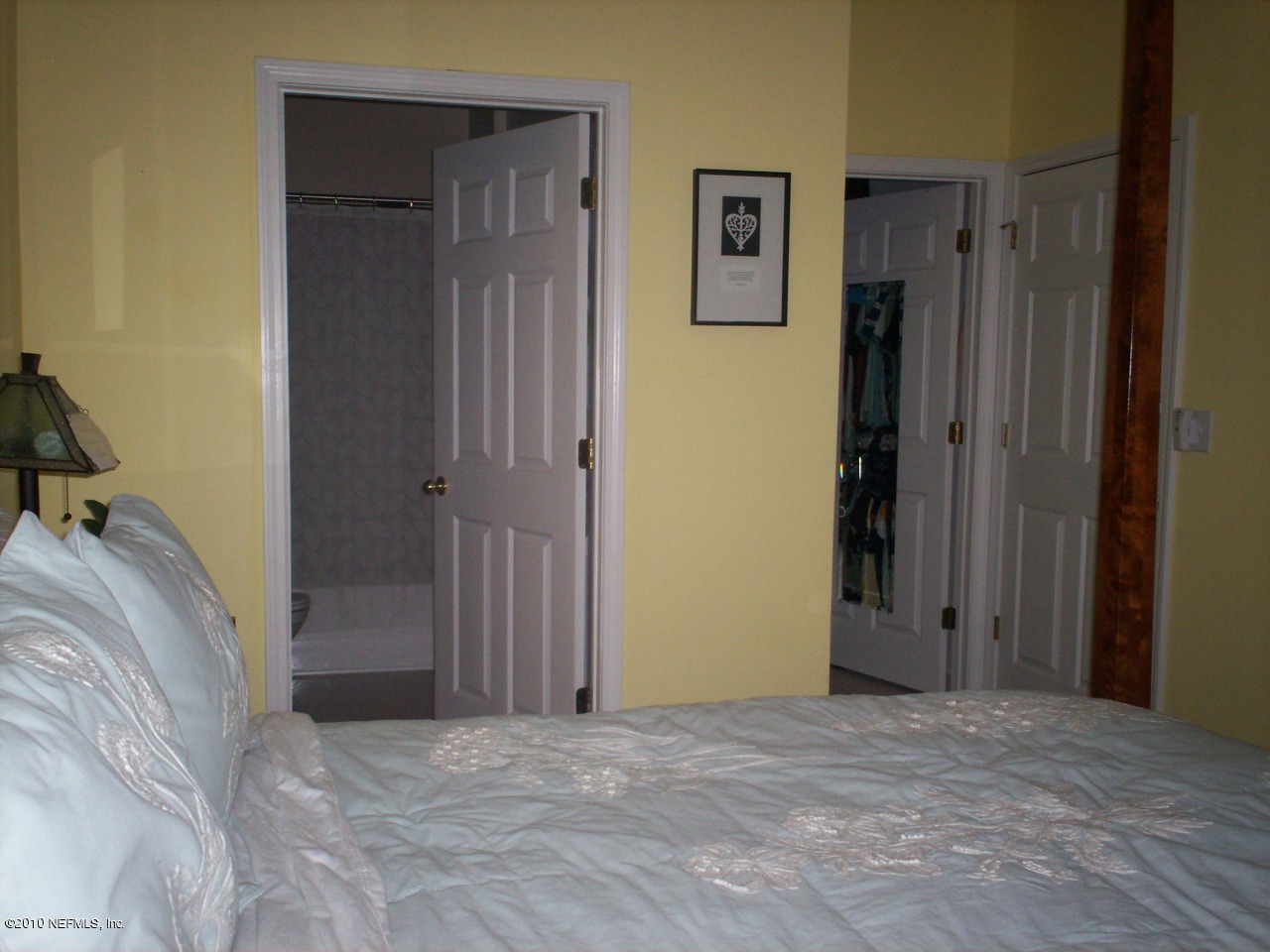 7920 Merrill Road, Unit 2104 Jacksonville, FL 32277 - Photo 6 of 9 a view of a bedroom with closet area