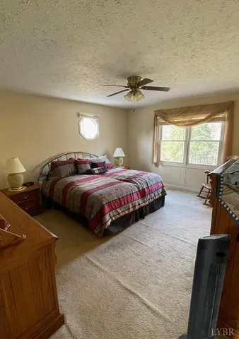 a bedroom with bed and window