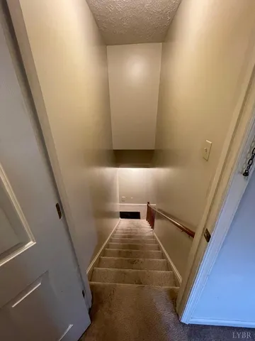 a view of hallway with stairs