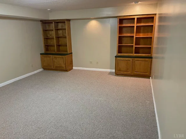 an empty room with a empty space and window