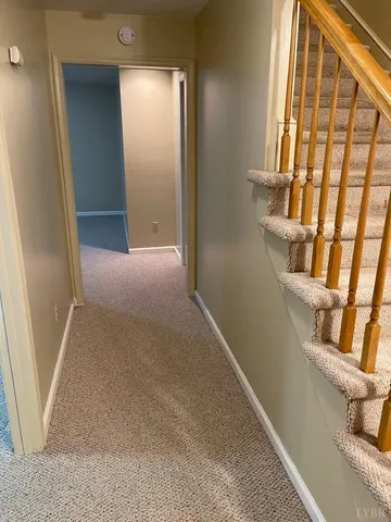 a bedroom with furniture window and outdoor view