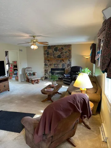 a living room with furniture fireplace and a flat screen tv