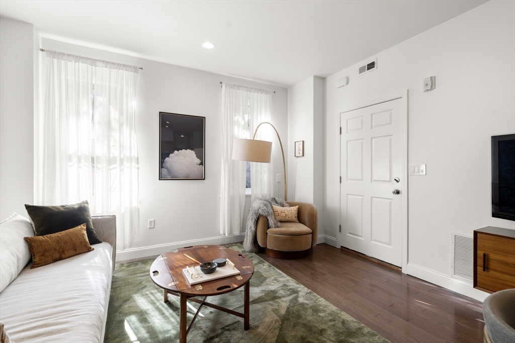 a living room with furniture and a window