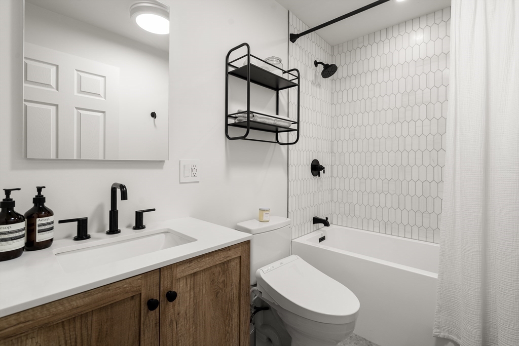 58 East Springfield Street, Unit 1 Boston, MA 02118 - Photo 18 of 21 a bathroom with a sink a toilet and shower