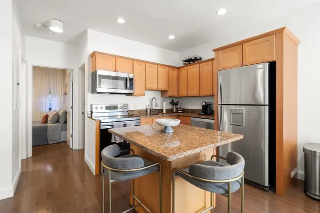 a kitchen with a refrigerator a stove a sink and a cabinets