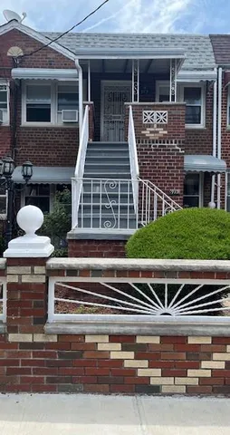 a view of house with outdoor space and parking space