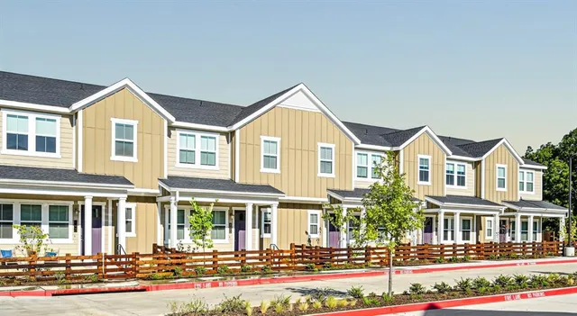 a front view of a residential houses with street