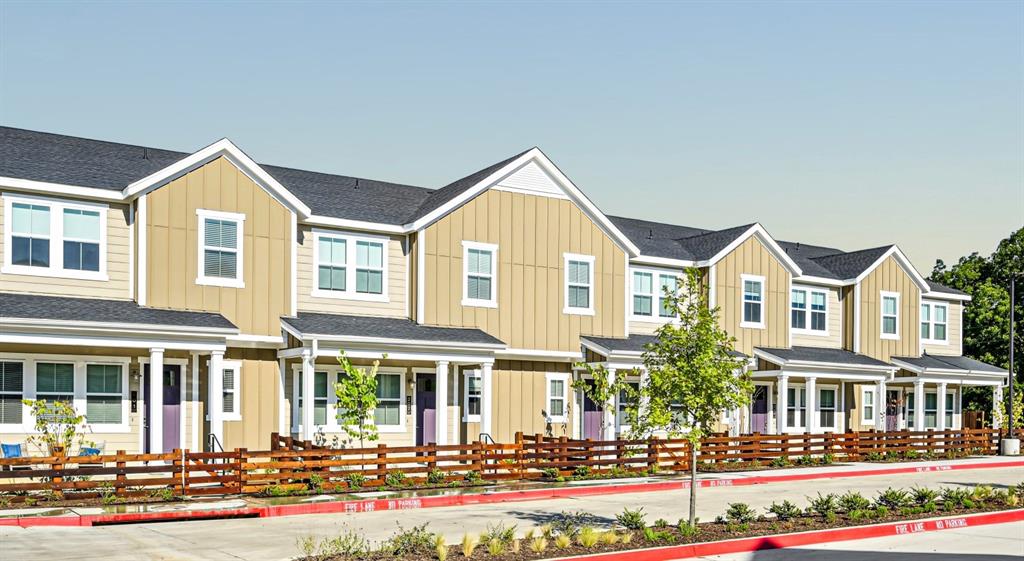 a front view of a residential houses with street