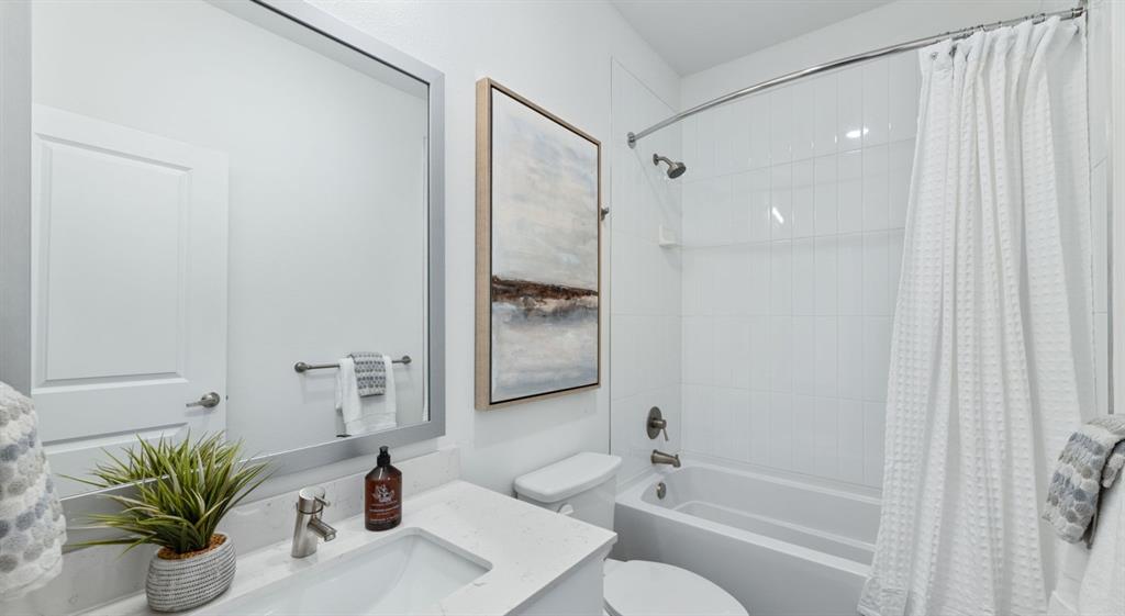 3800 West Lamberth Road, Unit 1302 Sherman, TX 75092 - Photo 13 of 15 a bathroom with a shower sink vanity mirror and toilet