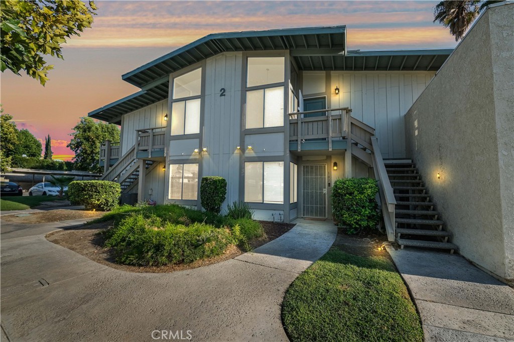 1800 East Old Ranch Road, Unit 108 Colton, CA 92324 - Photo 1 of 1 a front view of a house having yard