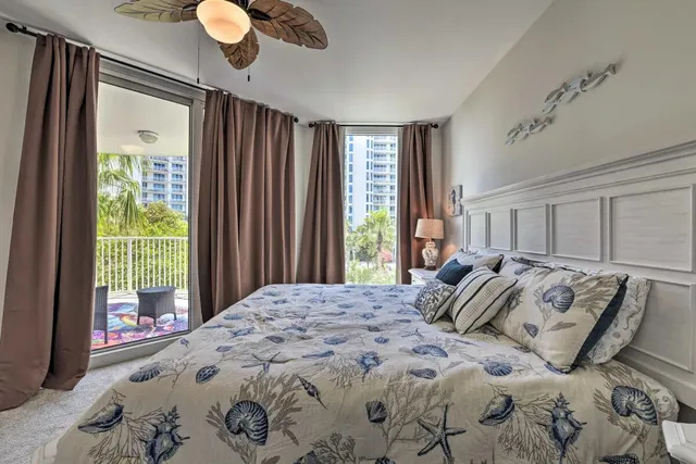 a bedroom with a large bed and a large window