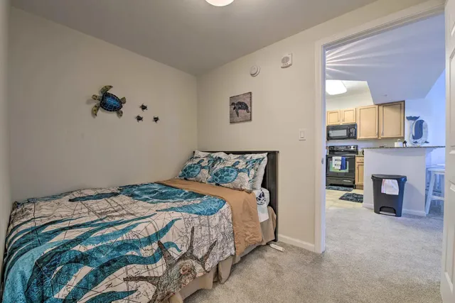 a bedroom with a bed and a fireplace