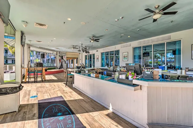 a living room with lots of furniture and white walls