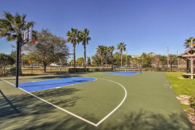 a view of a swimming pool with an outdoor space and seating area