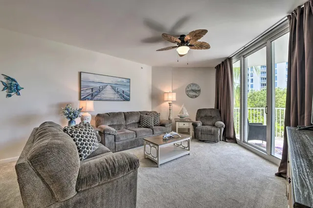 a living room with furniture and a large window