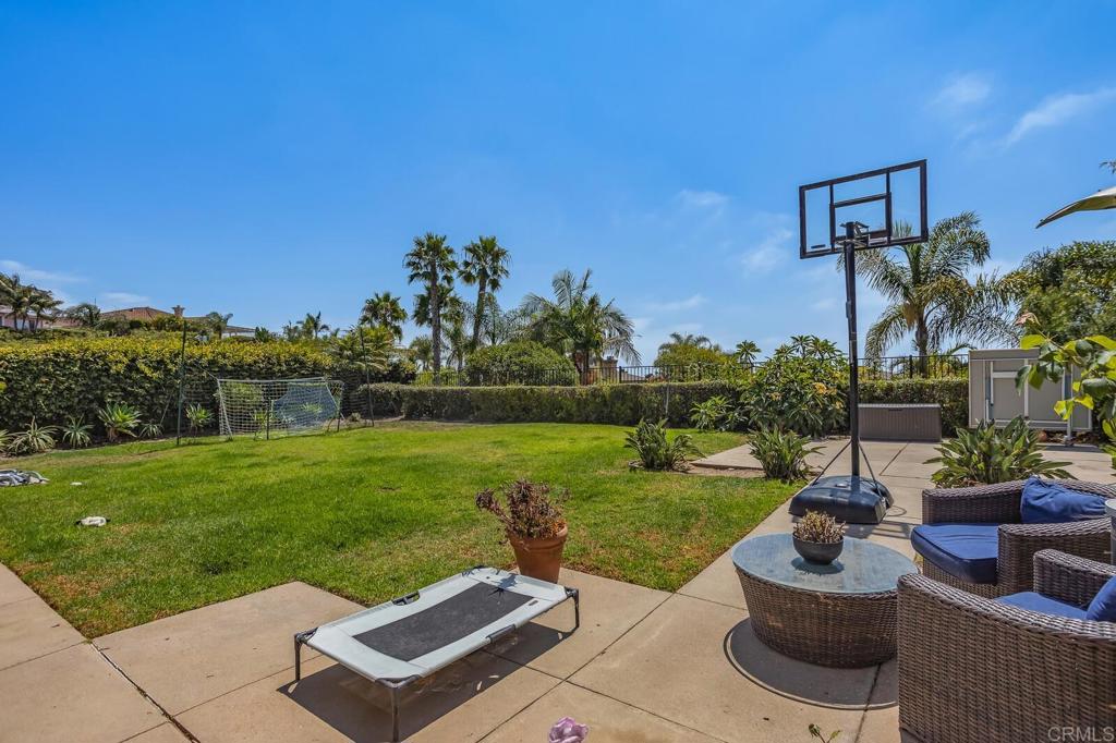 6743 Barberry Place Carlsbad, CA 92011 - Photo 8 of 10 a view of a backyard with plants and a garden