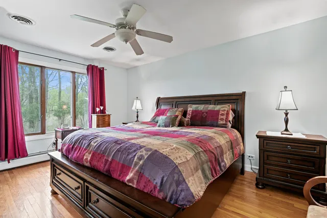 a bedroom with bed and window