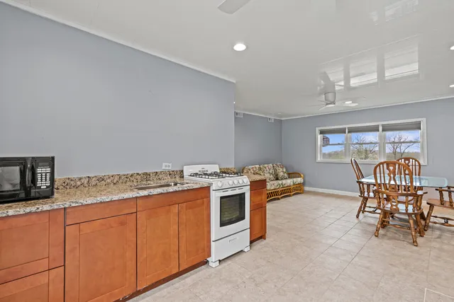an aerial view of a house with garden space and street view
