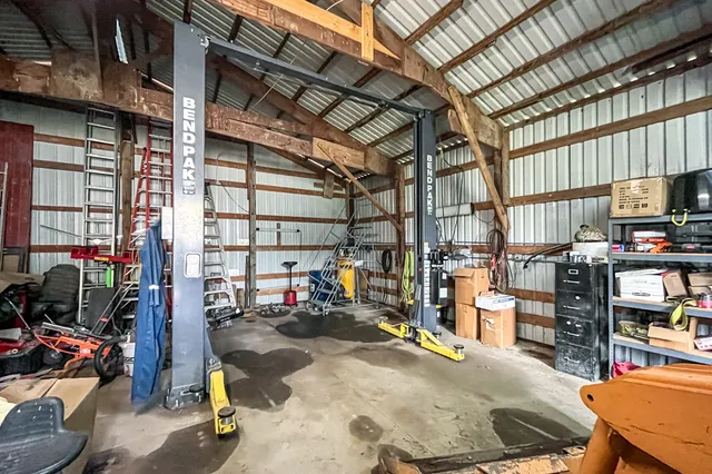an aerial view of a house with outdoor space and street view