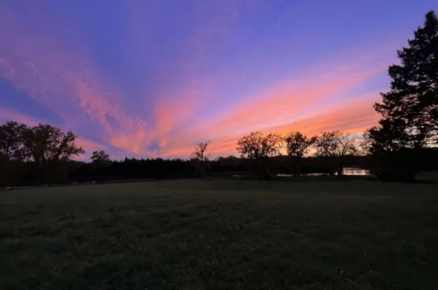 a view of lake with mountain in background