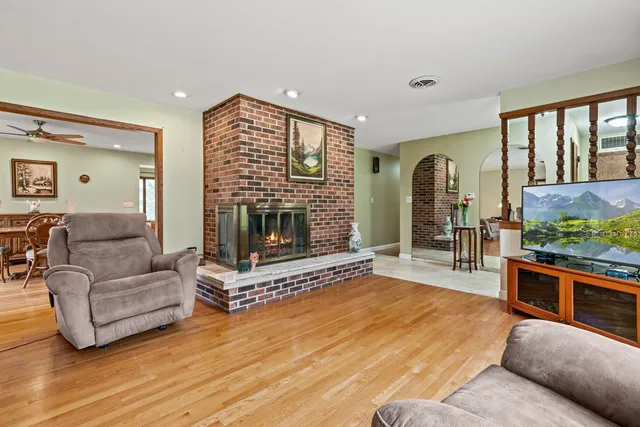 a living room with furniture and a fireplace
