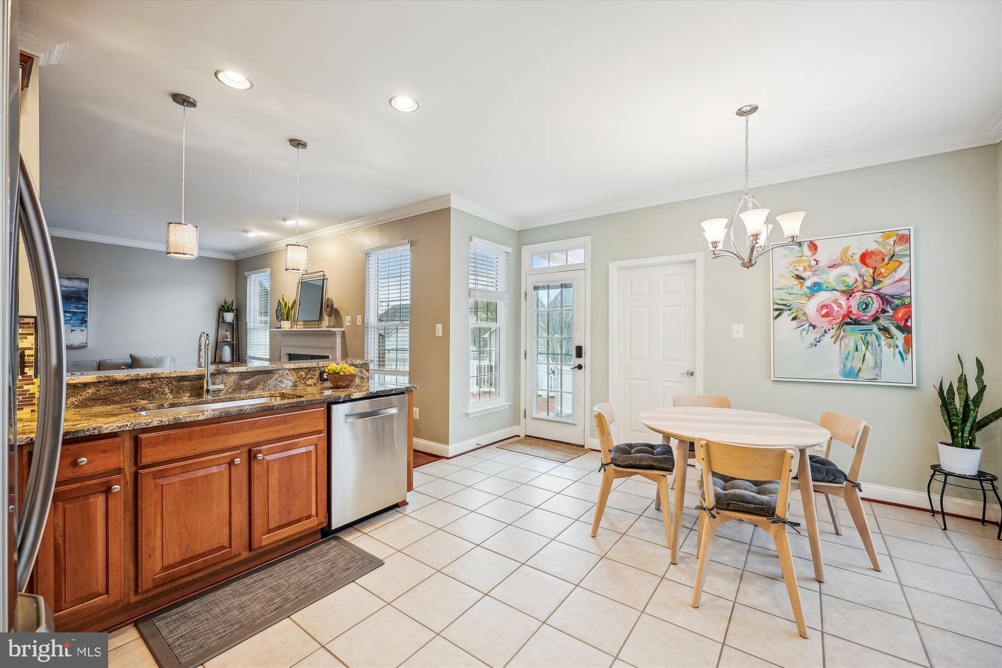 18301 Beechnut Way Boyds, MD 20841 - Photo 14 of 72 a kitchen with stainless steel appliances granite countertop a stove a sink dishwasher and a refrigerator with wooden floor