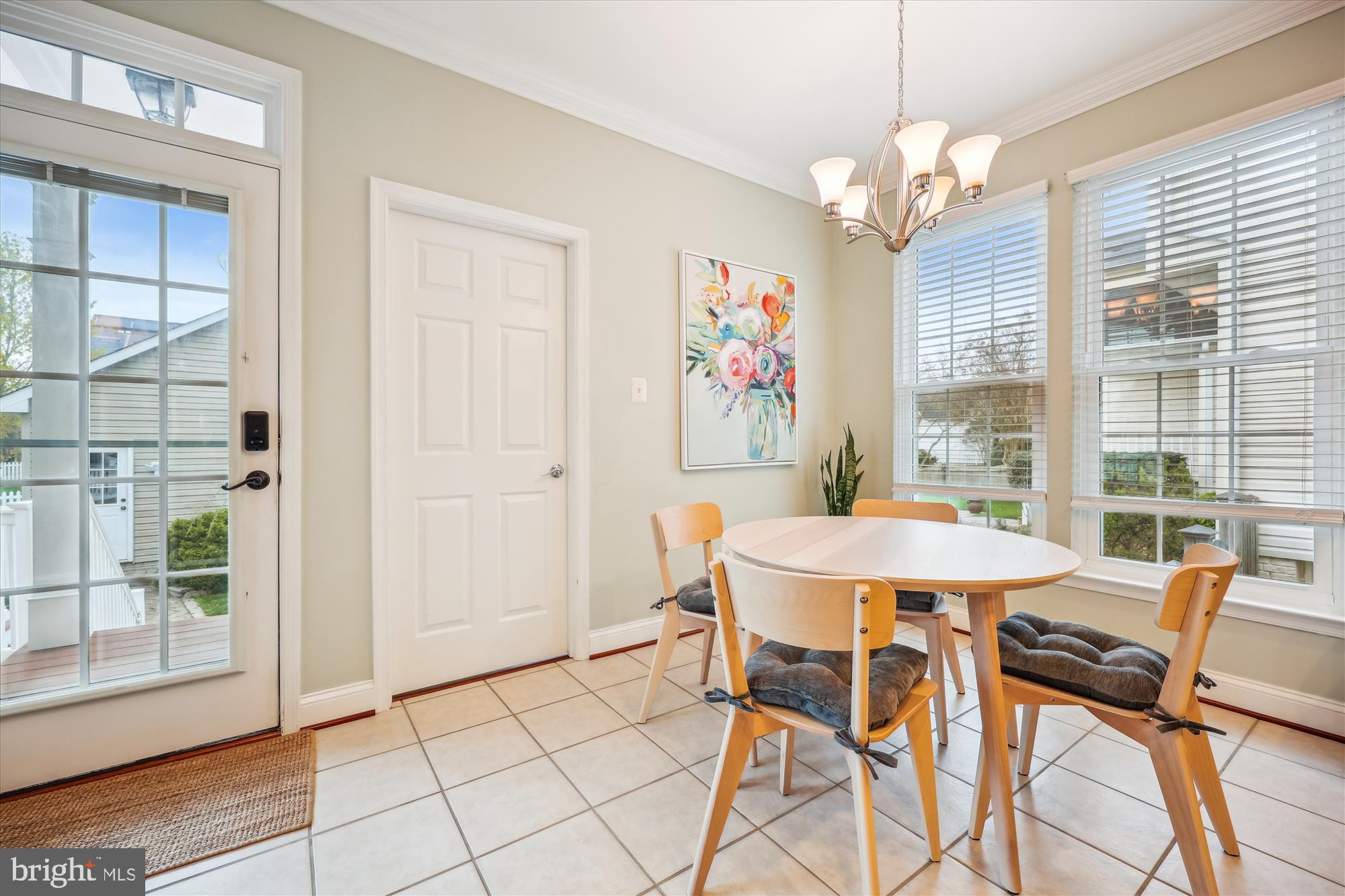 18301 Beechnut Way Boyds, MD 20841 - Photo 16 of 72 a view of a dining room with furniture a chandelier and wooden floor