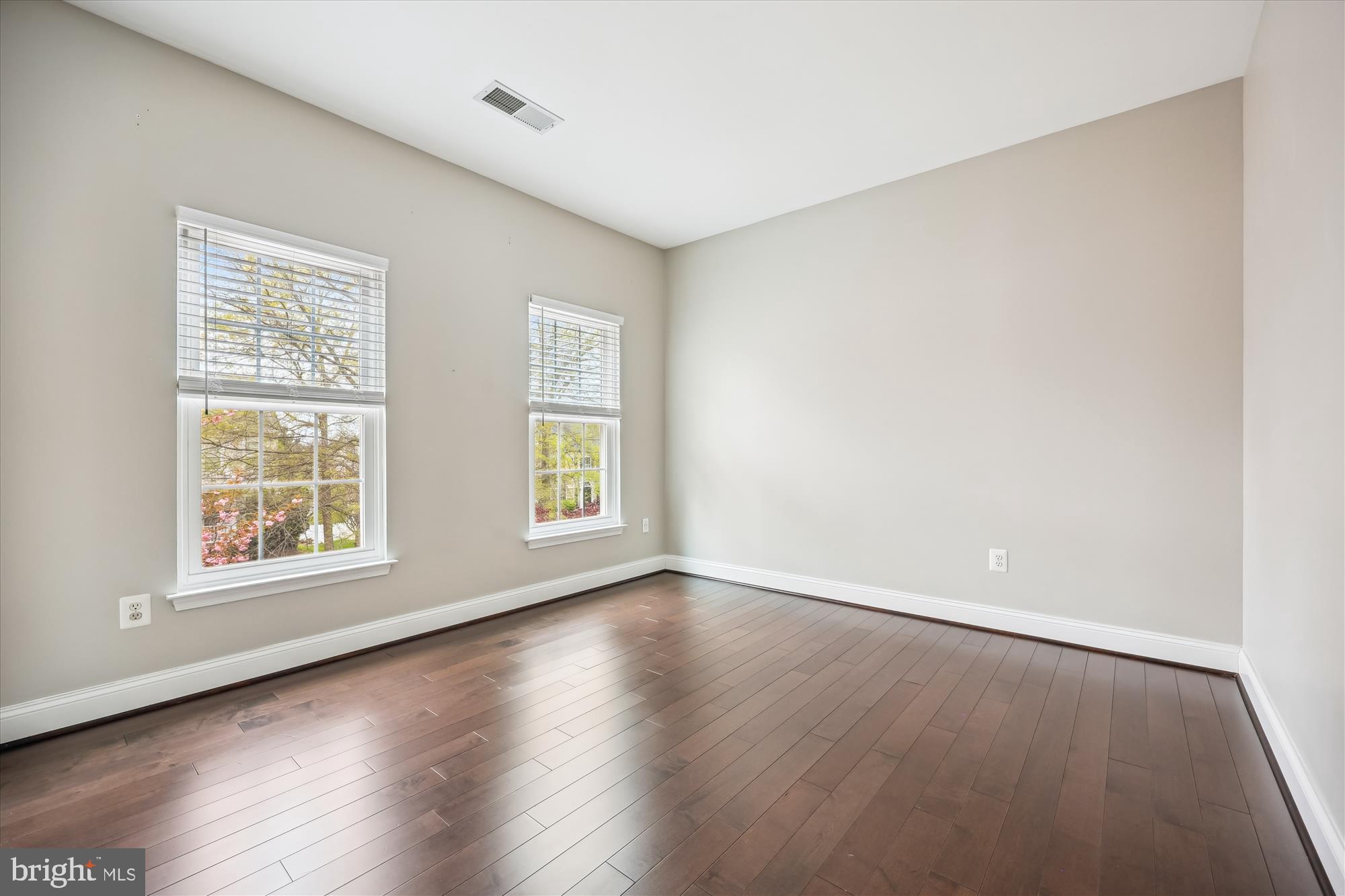 18301 Beechnut Way Boyds, MD 20841 - Photo 33 of 72 an empty room with wooden floor and windows