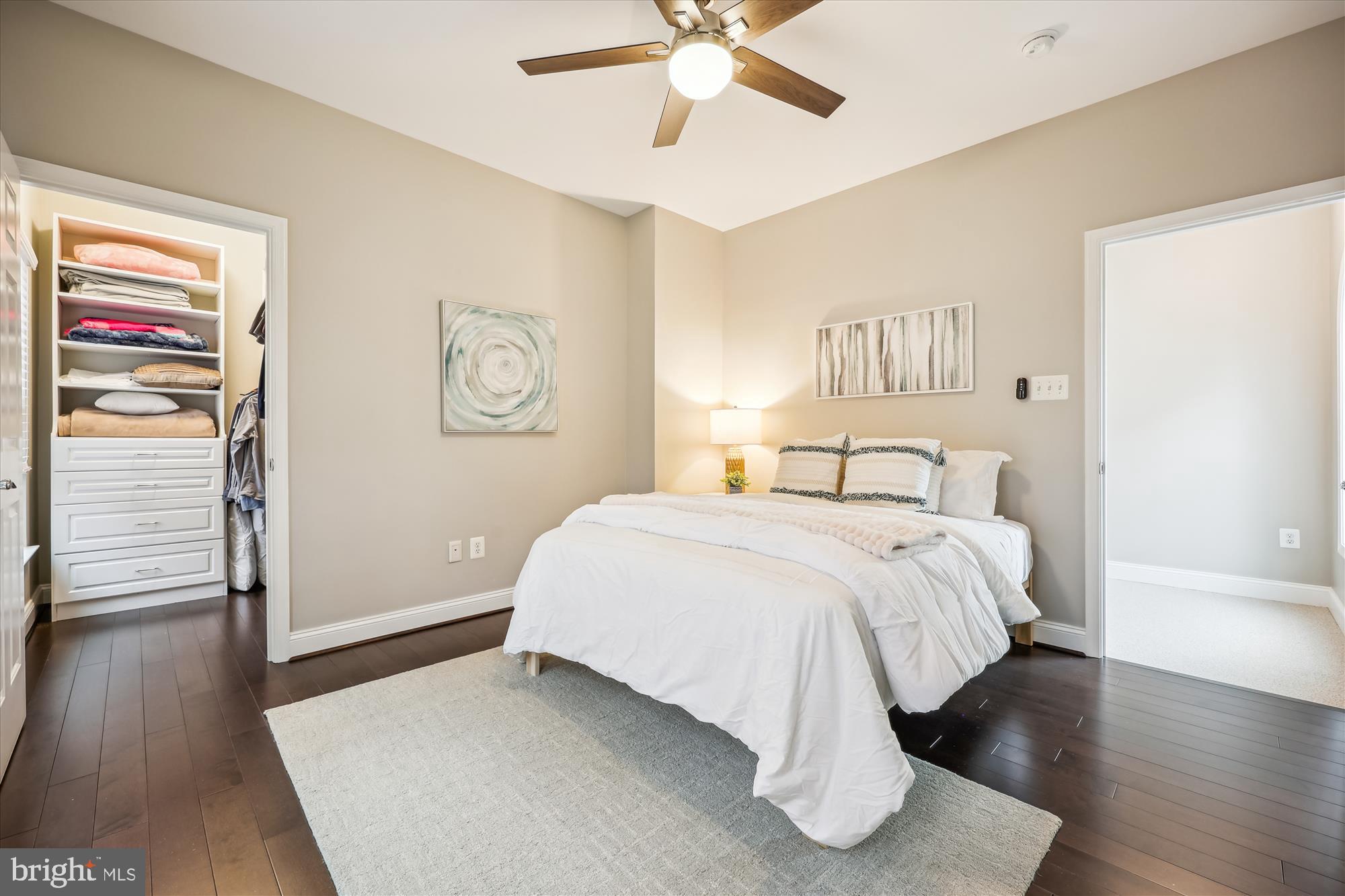 18301 Beechnut Way Boyds, MD 20841 - Photo 39 of 72 a spacious bedroom with a bed and wooden floor