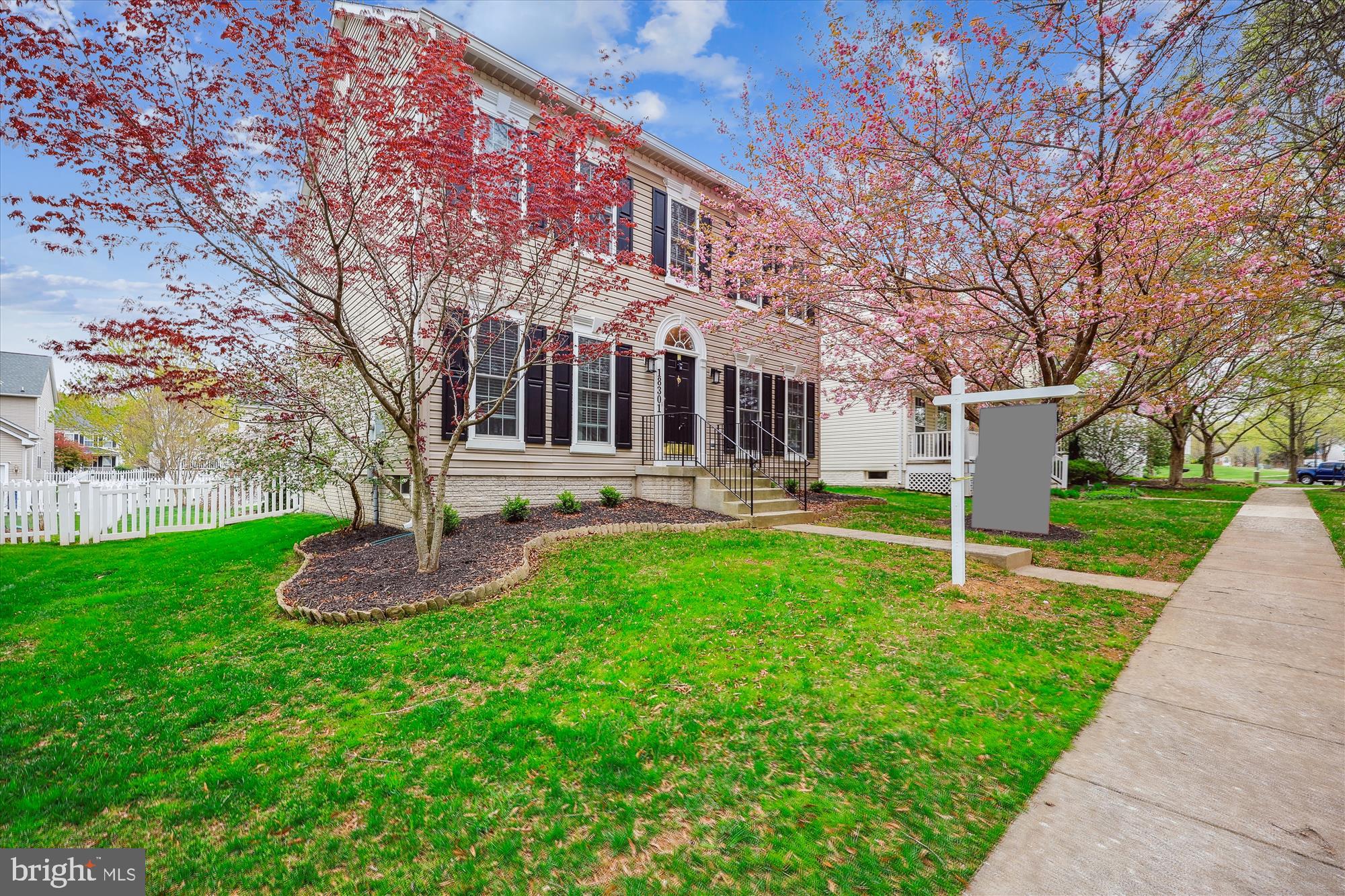 18301 Beechnut Way Boyds, MD 20841 - Photo 56 of 72 a front view of a building with a yard