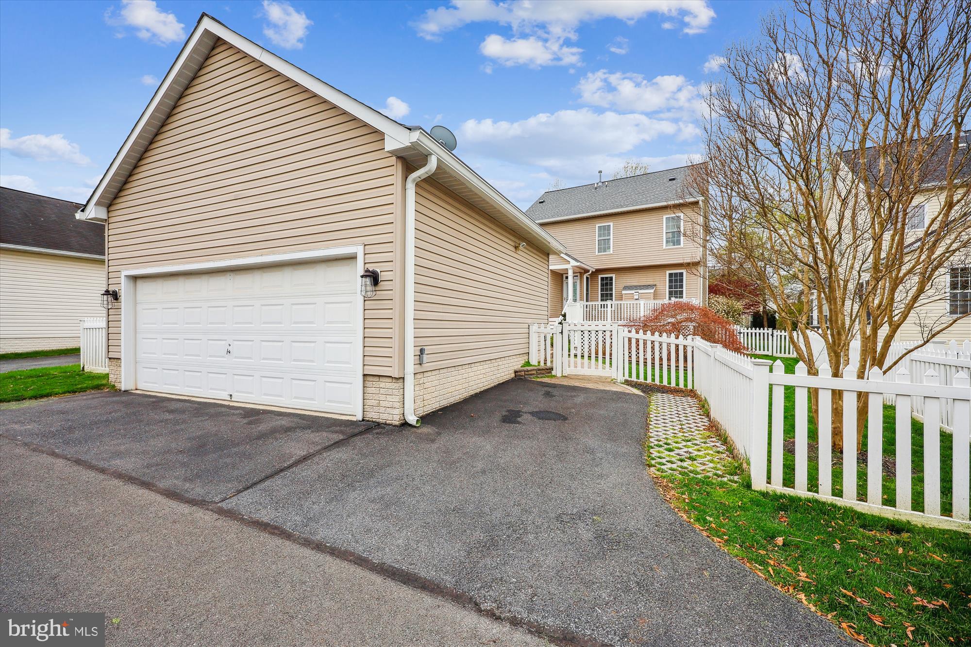 18301 Beechnut Way Boyds, MD 20841 - Photo 65 of 72 a view of a house with a yard and garage