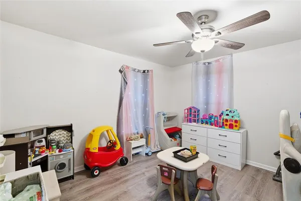 a living room with furniture and gym equipment