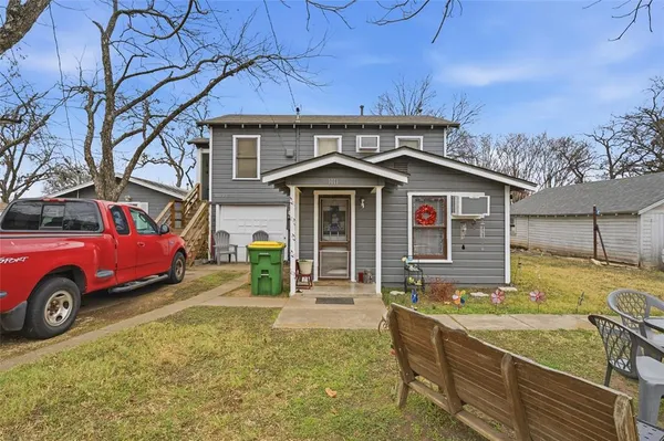 a picture of a bench in front of a wall