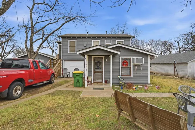 a picture of a bench in front of a wall