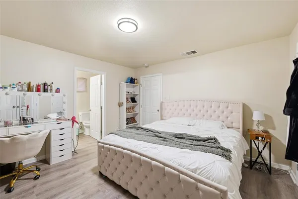 a room with a bed and a desk