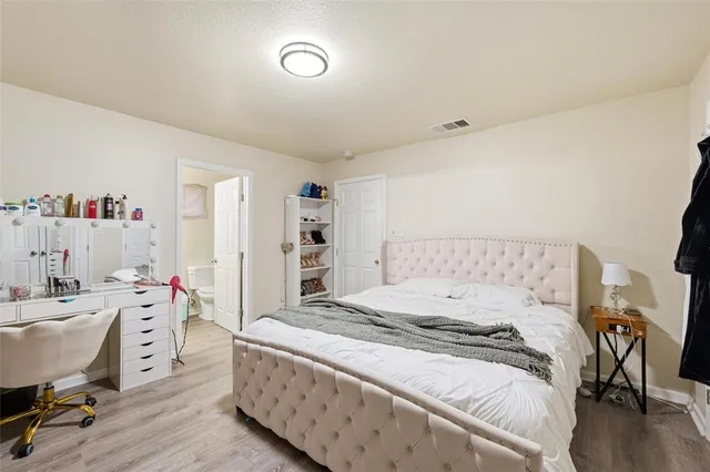 a room with a bed and a desk