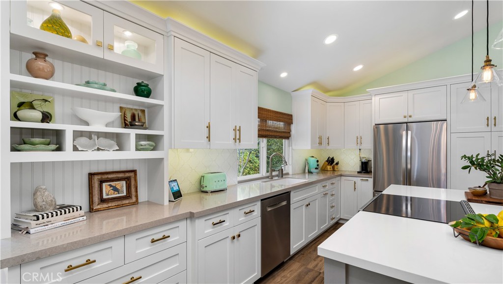 6 Mallard Irvine, CA 92604 - Photo 19 of 45 a kitchen with stainless steel appliances a white refrigerator a sink and a stove