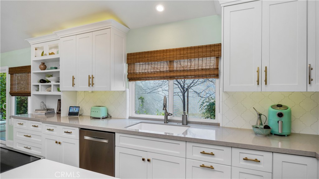 6 Mallard Irvine, CA 92604 - Photo 20 of 45 a kitchen with stainless steel appliances white cabinets and a window