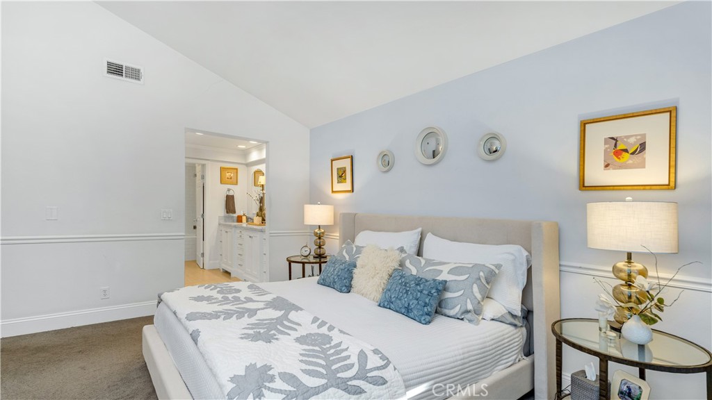 6 Mallard Irvine, CA 92604 - Photo 30 of 45 a bedroom with a bed and a lamp on table