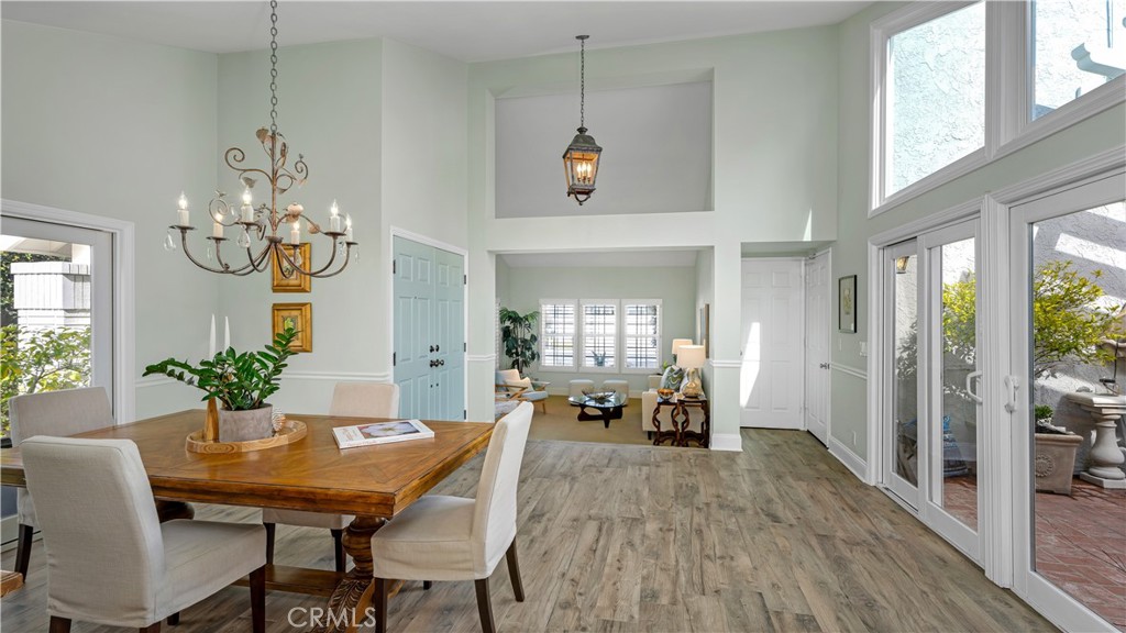 6 Mallard Irvine, CA 92604 - Photo 8 of 45 a view of a dining room with furniture window and wooden floor