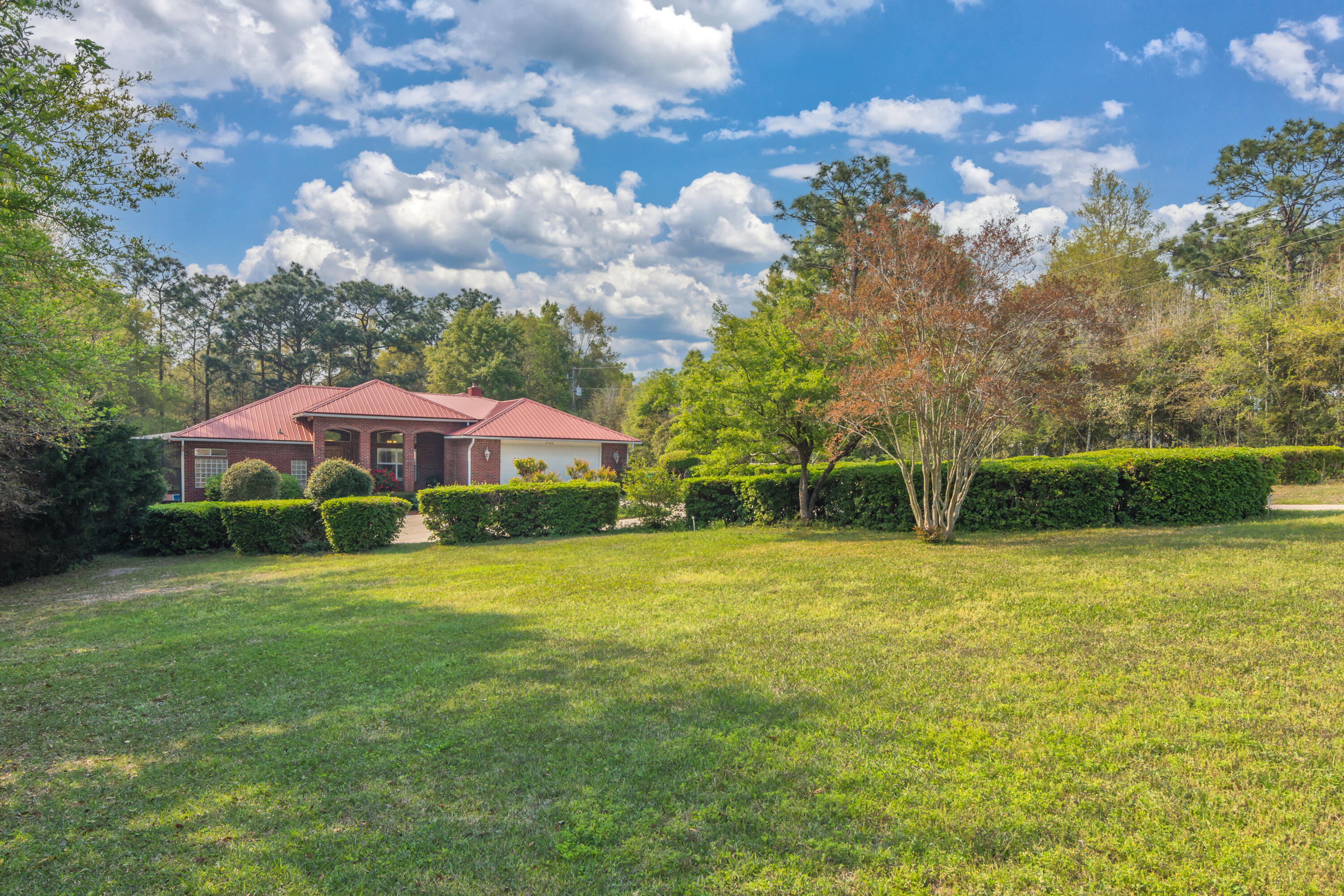 5766 Wildwood Road Crestview, FL 32536 - Photo 1 of 45 a view of a patio with a yard