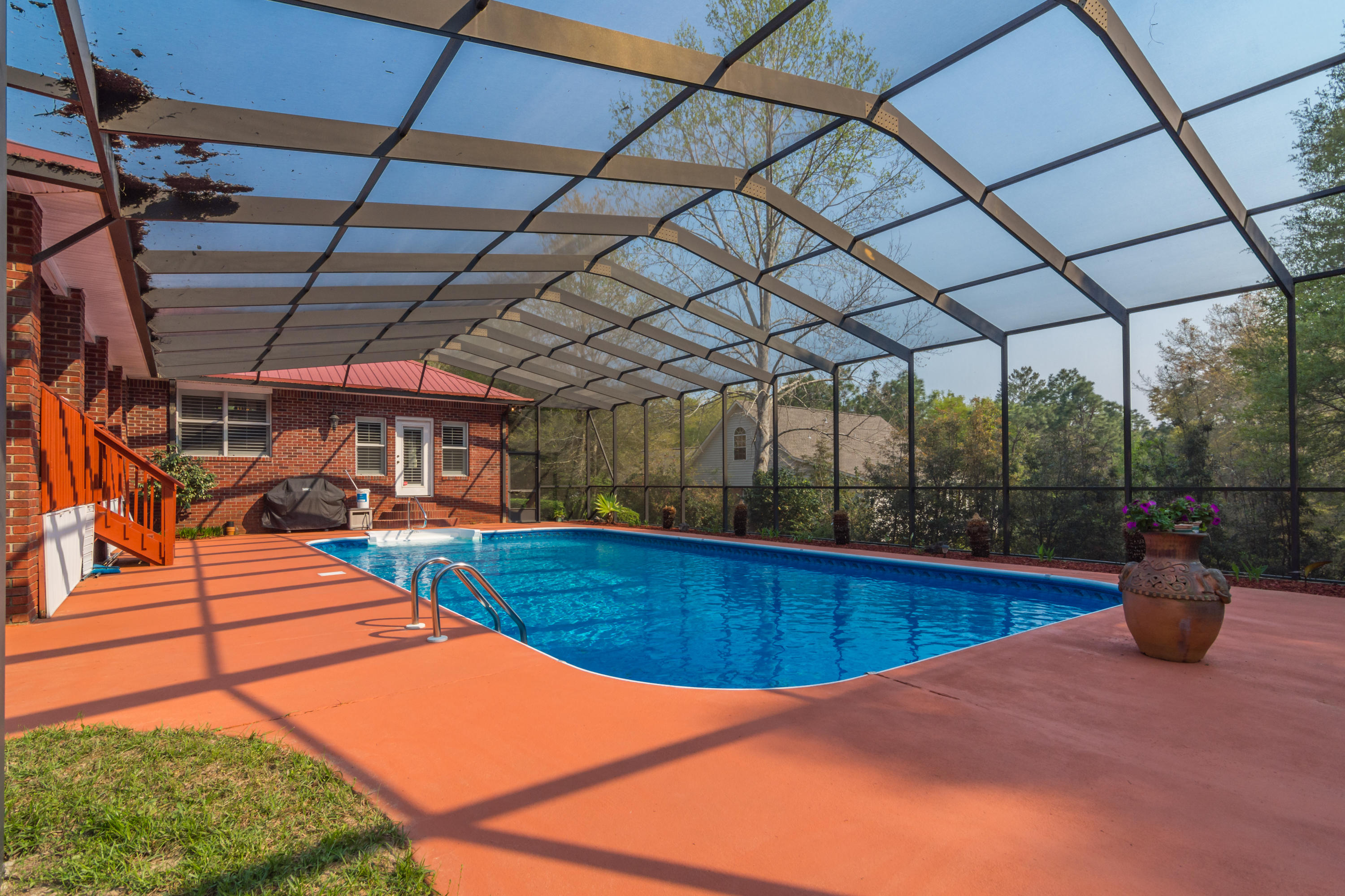 5766 Wildwood Road Crestview, FL 32536 - Photo 15 of 45 a view of a backyard with swimming pool