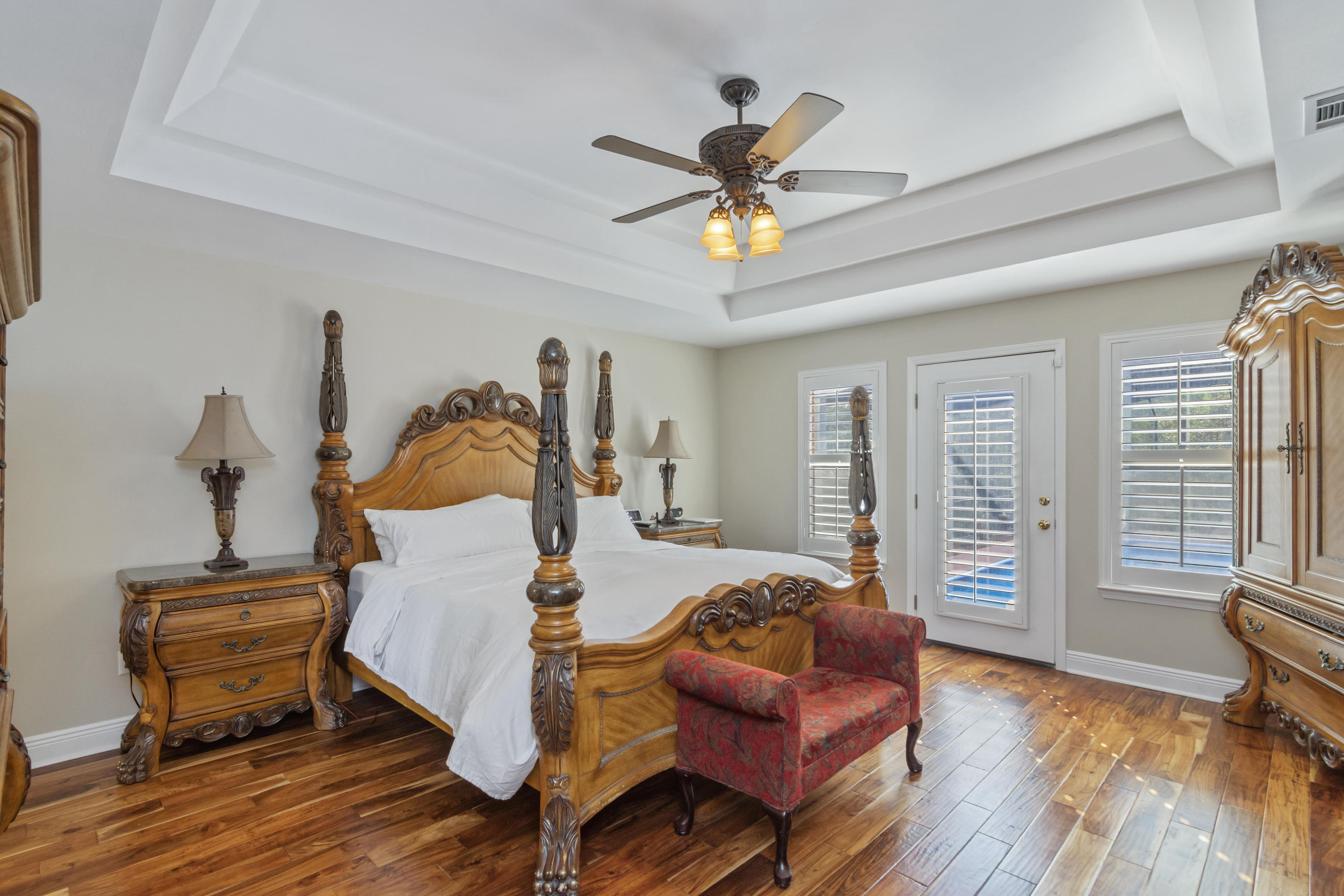 5766 Wildwood Road Crestview, FL 32536 - Photo 20 of 45 a bedroom with a bed wooden floor and window