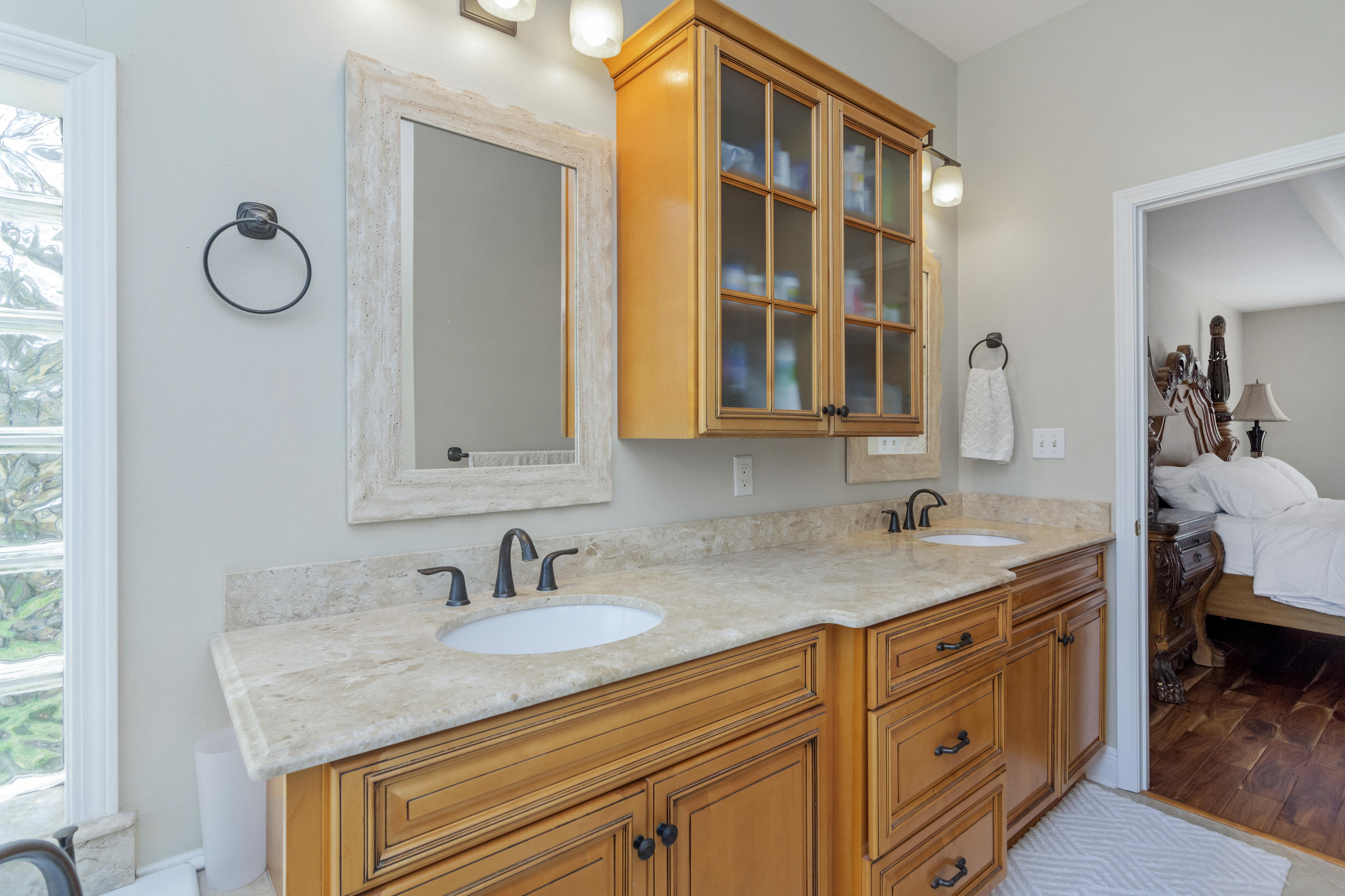 5766 Wildwood Road Crestview, FL 32536 - Photo 23 of 45 a en suite bathroom with a granite countertop sink and a mirror