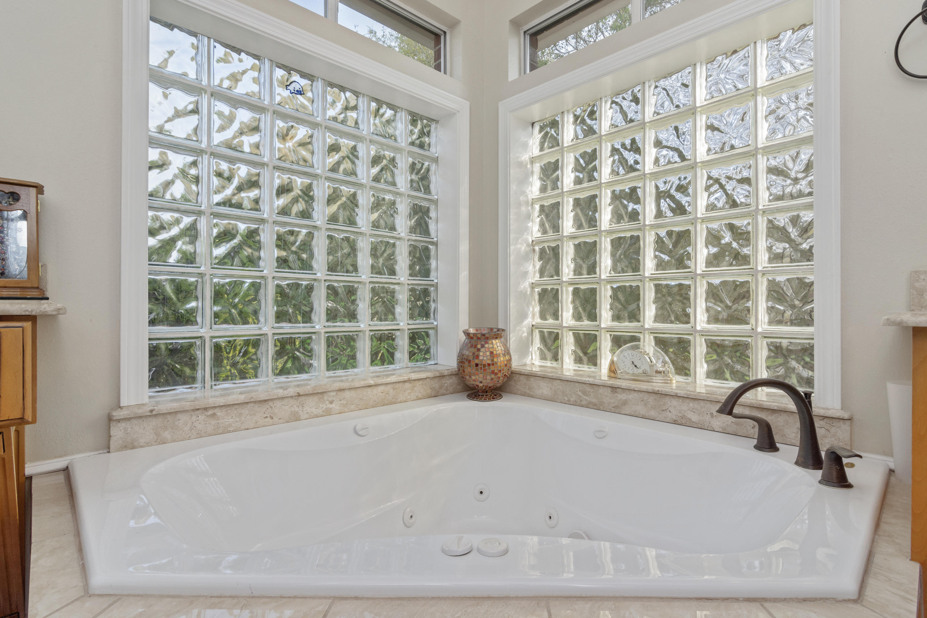 5766 Wildwood Road Crestview, FL 32536 - Photo 24 of 45 a bathroom with bathtub and window
