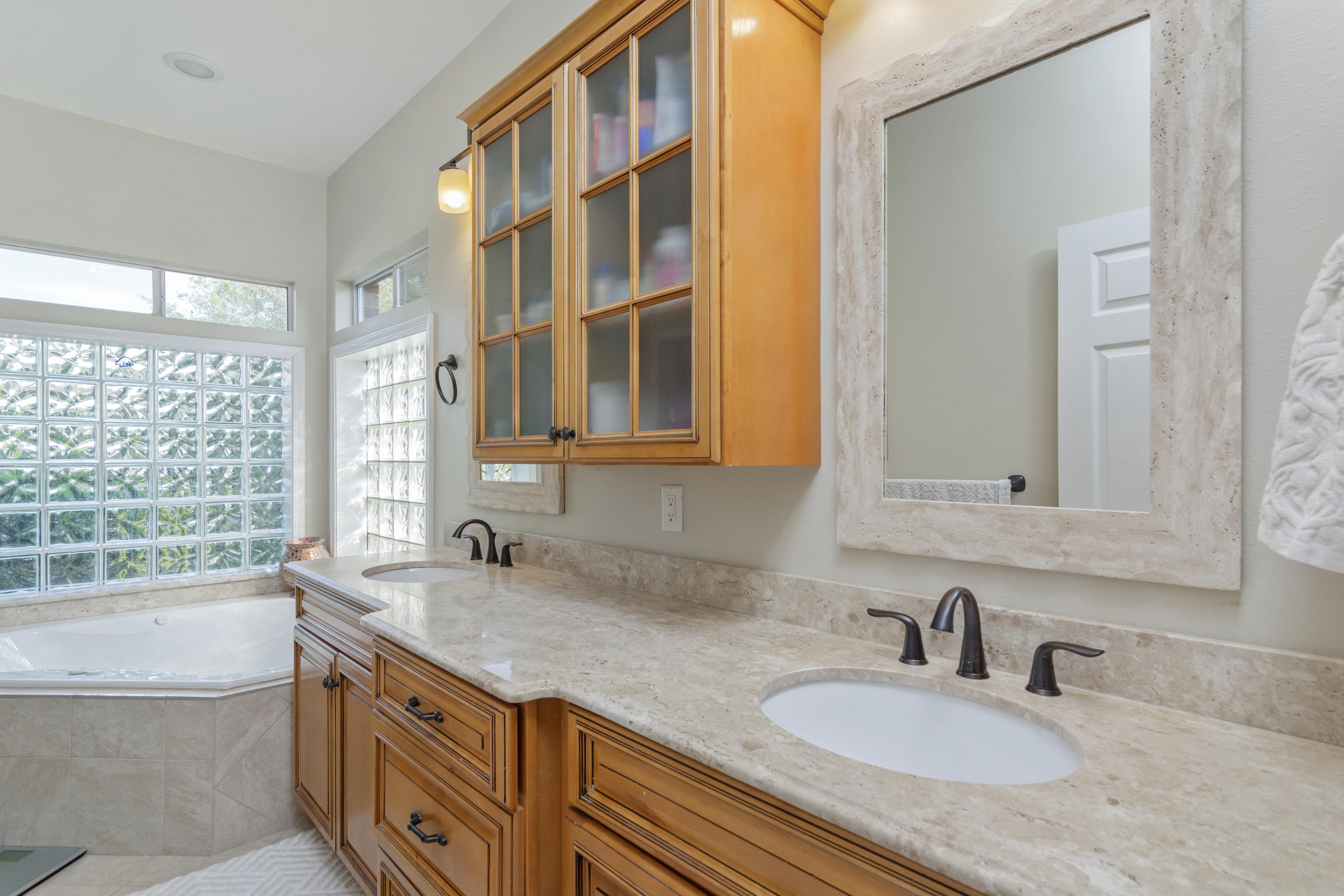 5766 Wildwood Road Crestview, FL 32536 - Photo 25 of 45 a bathroom with a granite countertop sink and a mirror