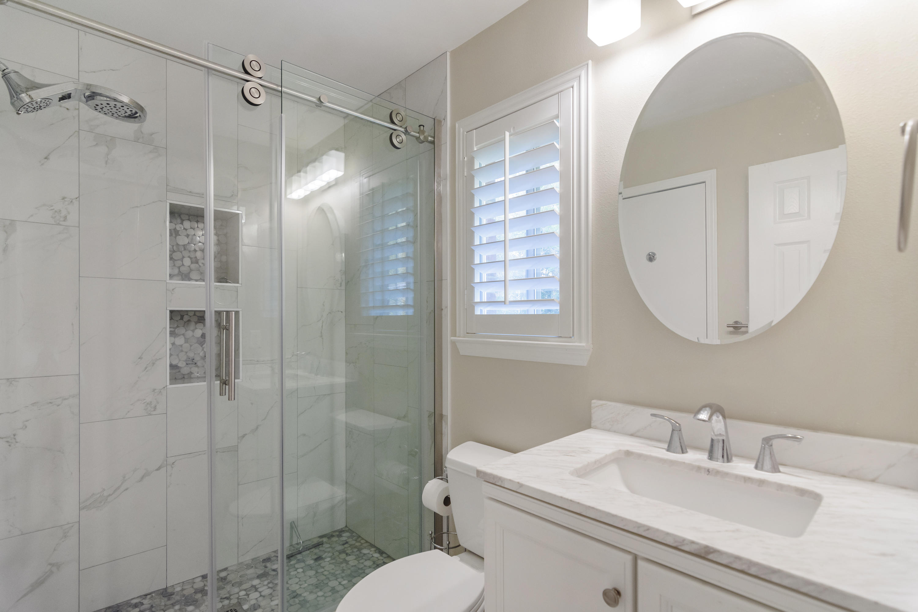 5766 Wildwood Road Crestview, FL 32536 - Photo 29 of 45 a bathroom with a sink toilet and shower